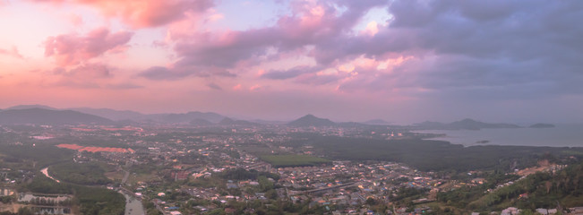the sun above big Buddha 
 big Buddha on the mountain can see from Panwa cape. aerial photography from Panwa cape you can see Palay pier, Chalong pier and boats in Chalong bay
