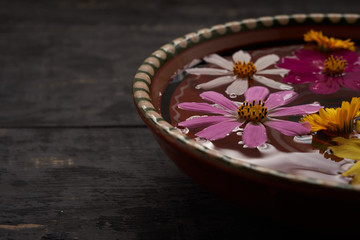 bowl of wild flowers on a wooden table