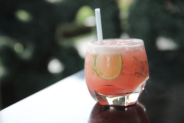 Pink cocktail with lime and mint