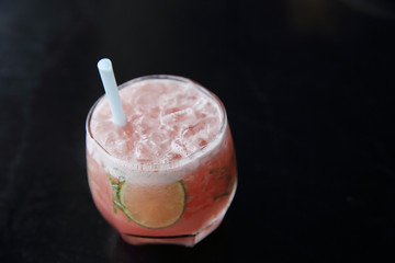 Pink cocktail with lime and mint