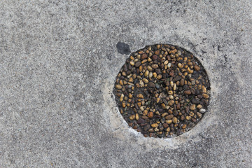 Concrete floor texture with round stone