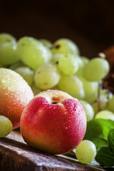 Grapes and nectarines, vintage wooden background, selective focu