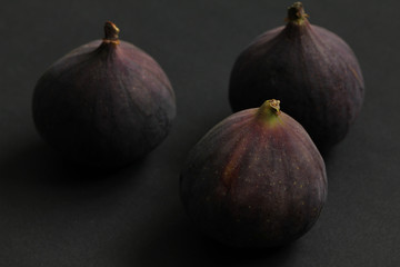 Fresh figs isolated on black beautiful food background