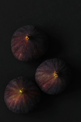 Fresh figs isolated on black beautiful food background