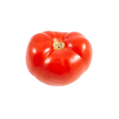 A tomato. Red tomato on a white background. Harvest vegetables. Autumn harvest. Red, juicy, ripe tomato.