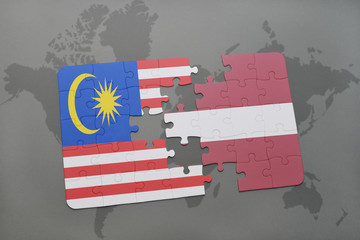 puzzle with the national flag of malaysia and latvia on a world map background.