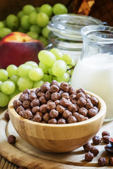 Breakfast: chocolate balls, fresh cows milk, grapes and peaches,