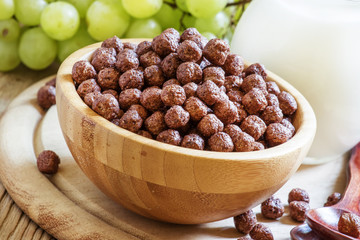 Breakfast: chocolate balls, fresh cows milk, grapes and peaches,