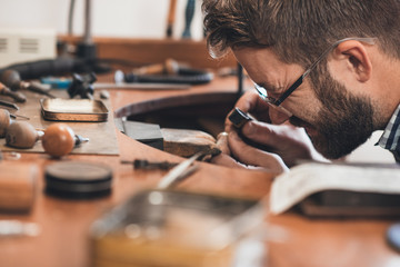 Giving his work a closeup inspection