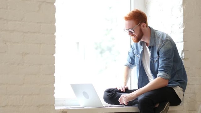 Skype Chat, Online Video Conference by Man Sitting in Window, Beard, Red Hairs