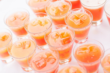 Colorful cocktails close up. an open-air party. orange and ice