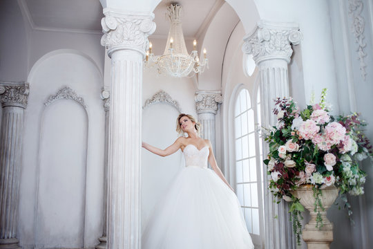 Charming young bride in luxurious wedding dress. Pretty girl, the photo Studio