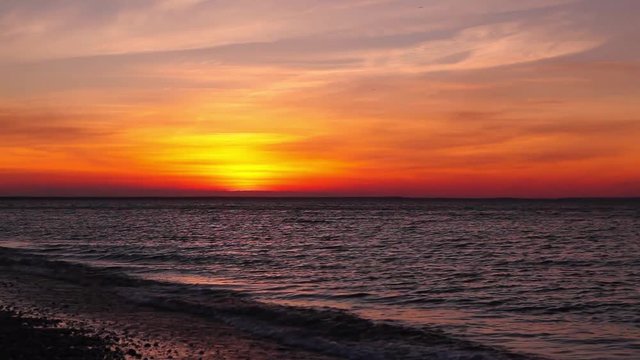 Dramatic sunset on the empty beach, Cape Cod, USA