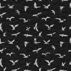 Grunge seamless pattern of flying birds black background. Vector illustration