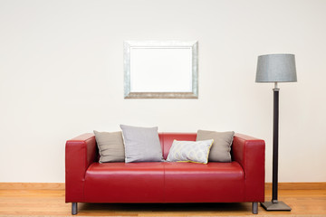 Interior with red Sofa and picture frame