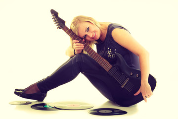 Fototapeta premium Woman with electrical guitar and vinyl record.