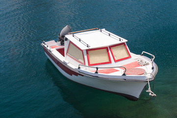 Small motorboats moored in clean water