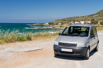 Fototapeta na wymiar European car on the coast road