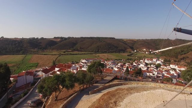 Old Mill on the hill in Odeceixe -Portuguese tourist town aerial view