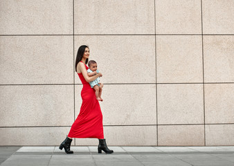 Fashionable modern mother on a city street