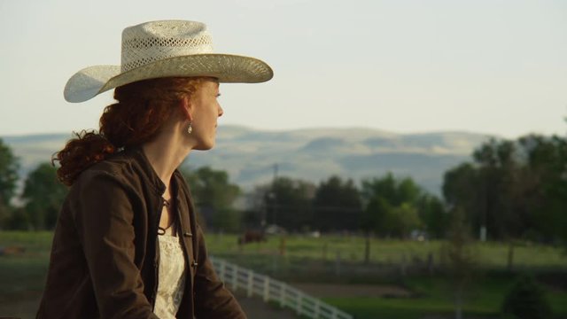Portrait of female cowboy on a ranch