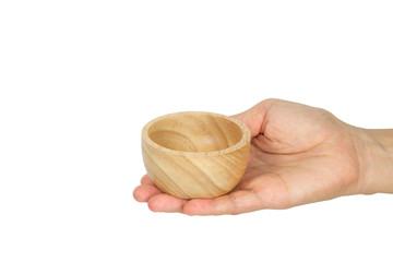 Hand holding wooden cup