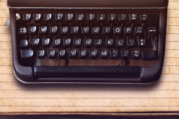 Keyboard on a vintage typewriter on paper background