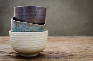 Empty bowl on rustic wood, Japanese handmade ceramic bowl,  ceramic texture - obrazy, fototapety, plakaty
