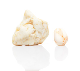 Two white mineral stones with reflection isolated on white
