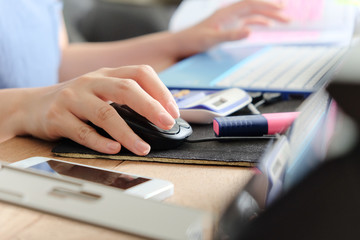 woman hand using a computer mouse, working time