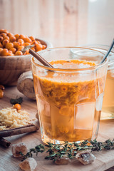 sea buckthorn berries honey ginger mix in glass