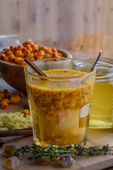 sea buckthorn honey ginger mix in glass with cinnamon