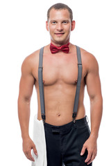 Fototapeta premium portrait of a waiter in a bow tie and suspenders on a white back
