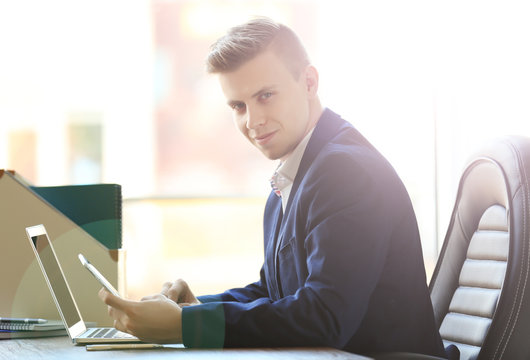 Lawyer working with laptop in office