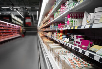 Supermarket shelves with dairy products