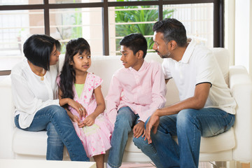 happy indian family at living room