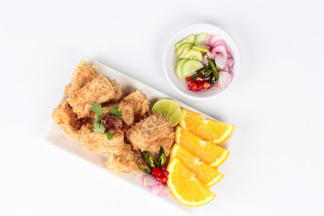 Fried tofu nuggets with minced shrimp and pork on white background.