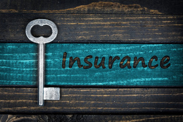Insurance word and old key