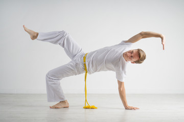 Naklejka premium Man practicing capoeira , brazilian martial art.