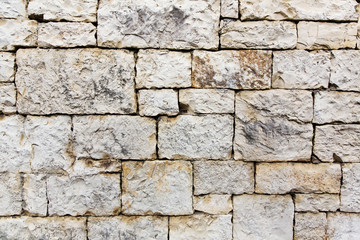 Ancient wall built of white stone