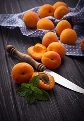 Sweet apricots on wooden background