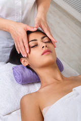 Obraz na płótnie Canvas Woman beautician doctor make neck massage in spa wellness center