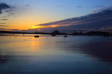 Sunrise over the Carrick Roads at high tide, Falmouth, Cornwall, England, UK.