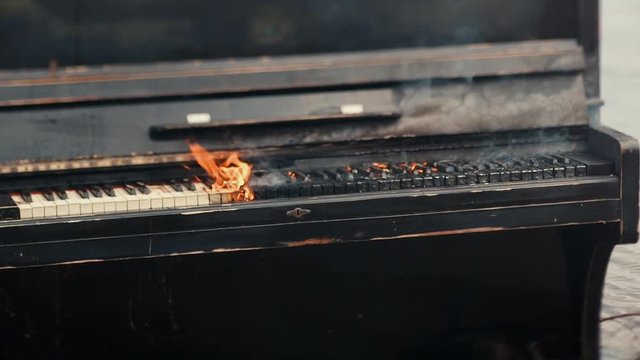 Black Piano in flames, dead muse concept