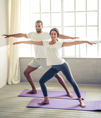 Fototapeta premium Afro American couple doing yoga