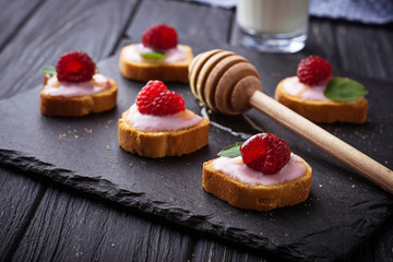Sweet sandwiches with cream cheese and raspberry