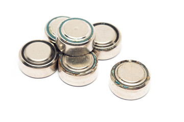 small watch rusty batteries isolated on white background