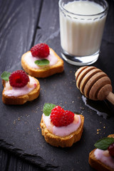 Sweet sandwiches with cream cheese and raspberry