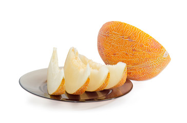 Several slices and half of melon on a light background