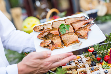 Fish.Barbecue smoked fish on catering.